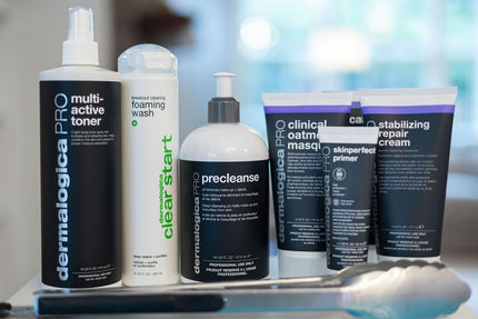 Collection of Dermalogica skincare products on a surface with a blurred background