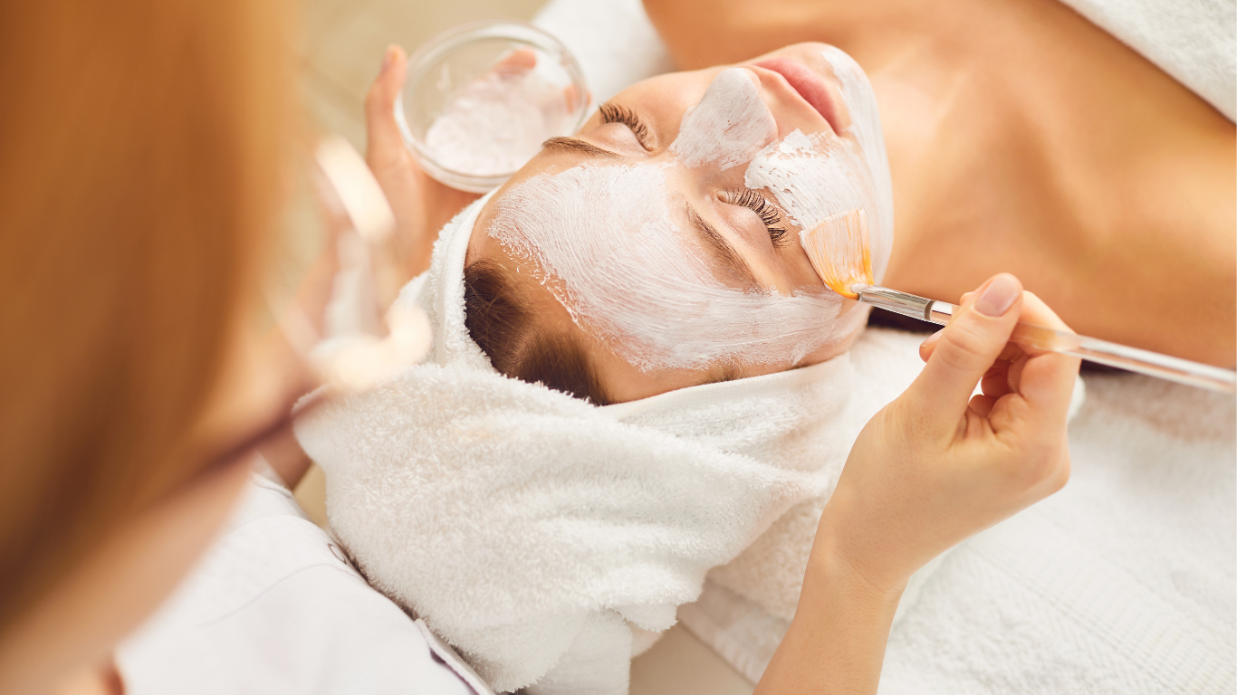 Girl getting spa face mask treatment